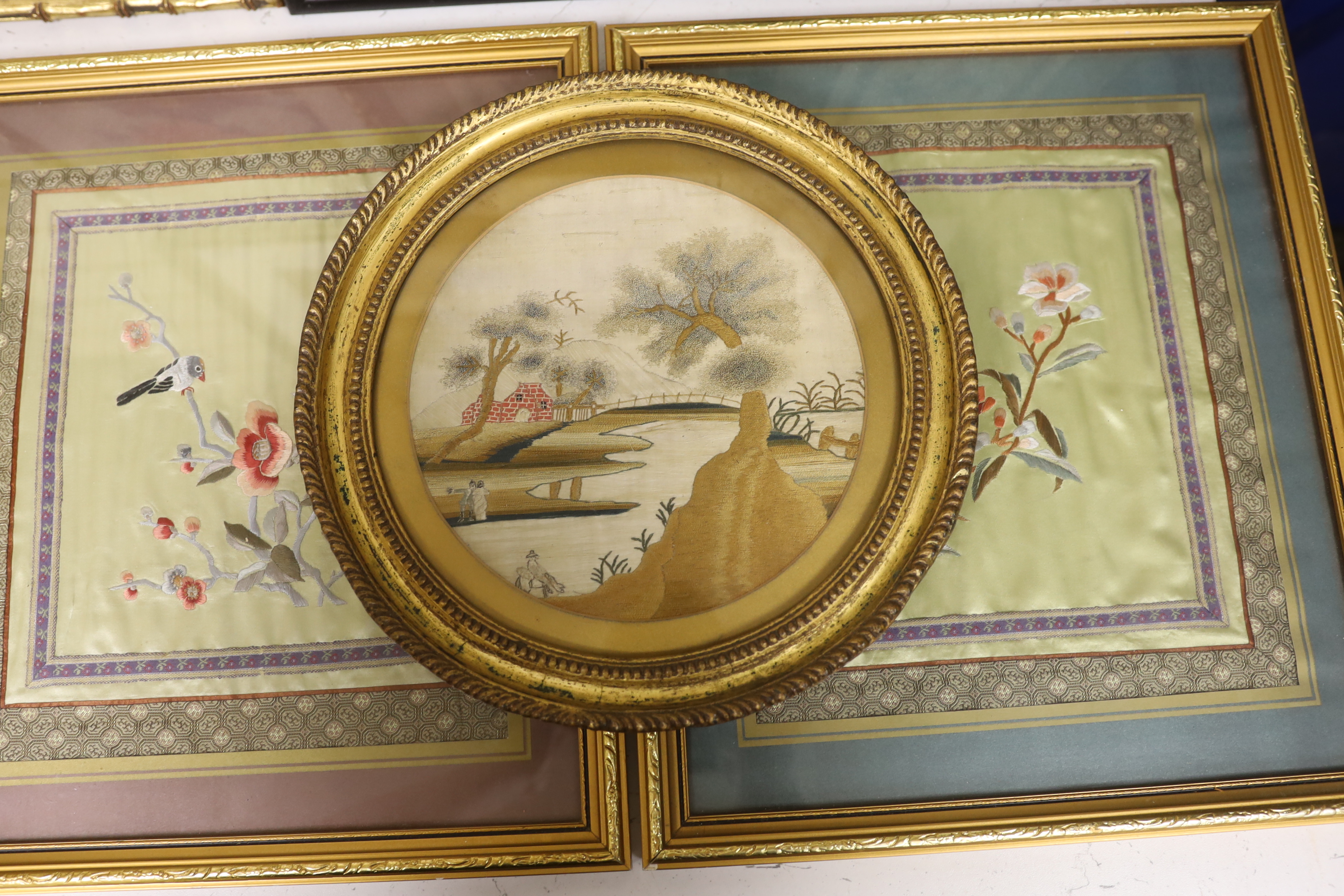 Two pairs of framed 20th century Chinese silk embroideries, two using Chinese knotting, a Hiroshima ‘Peacock and Peony’ print and a circular, figural landscape embroidery (6)